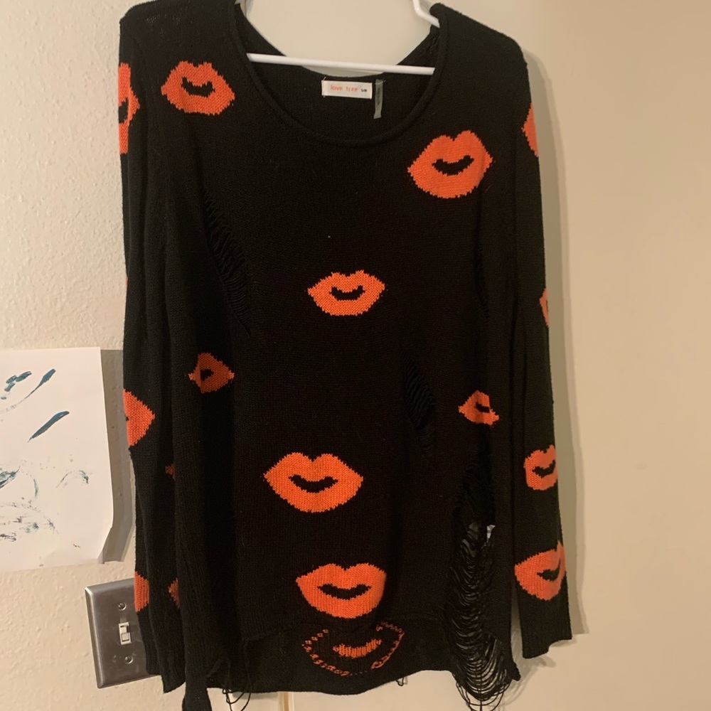 Distressed kiss sweater worn twice